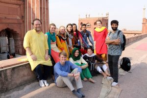 Students with their study abroad leaders Afroz Taj and John Caldwell at a site in India.