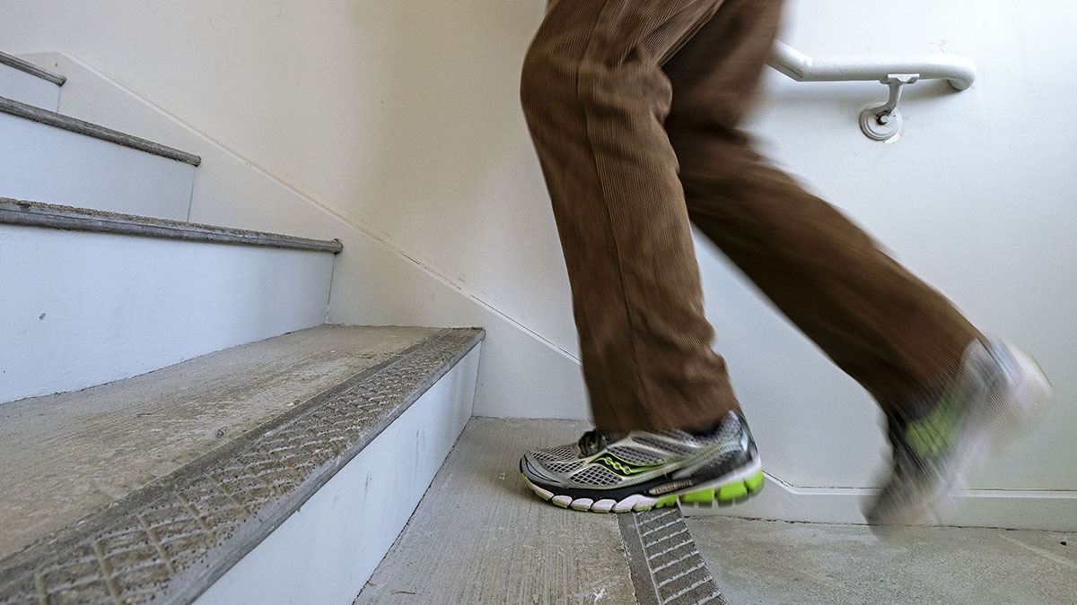Detail photo of someone heading up stairwell in FedEx Global. (Jon Gardiner/UNC-Chapel Hill)