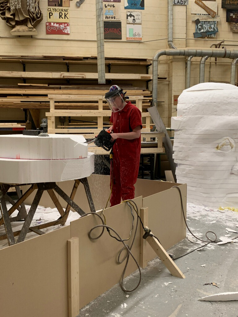 Behind the scenes as Jessica Secrest works on a large cast of Julius Caesar's head.