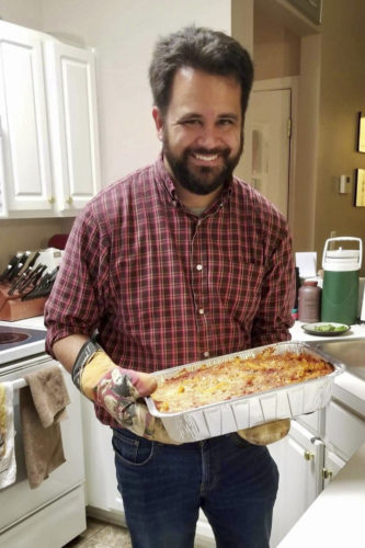 Frey, who loves to cook, proudly displays a fresh batch of lasagna.