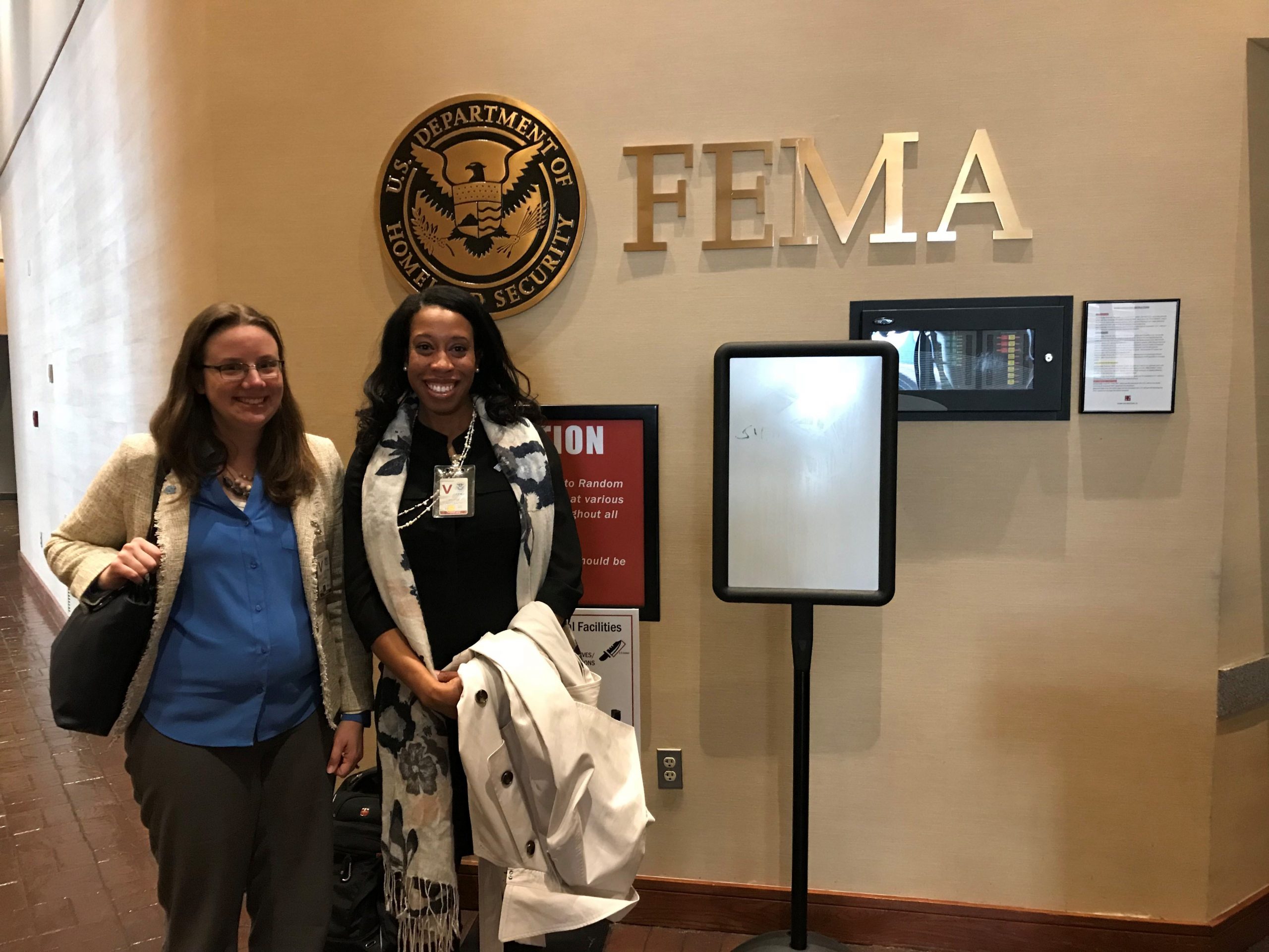Cassandra R. Davis (right) and her colleague Sarah Fuller (research assistant professor in public policy) present research findings to FEMA in Washington, D.C.  