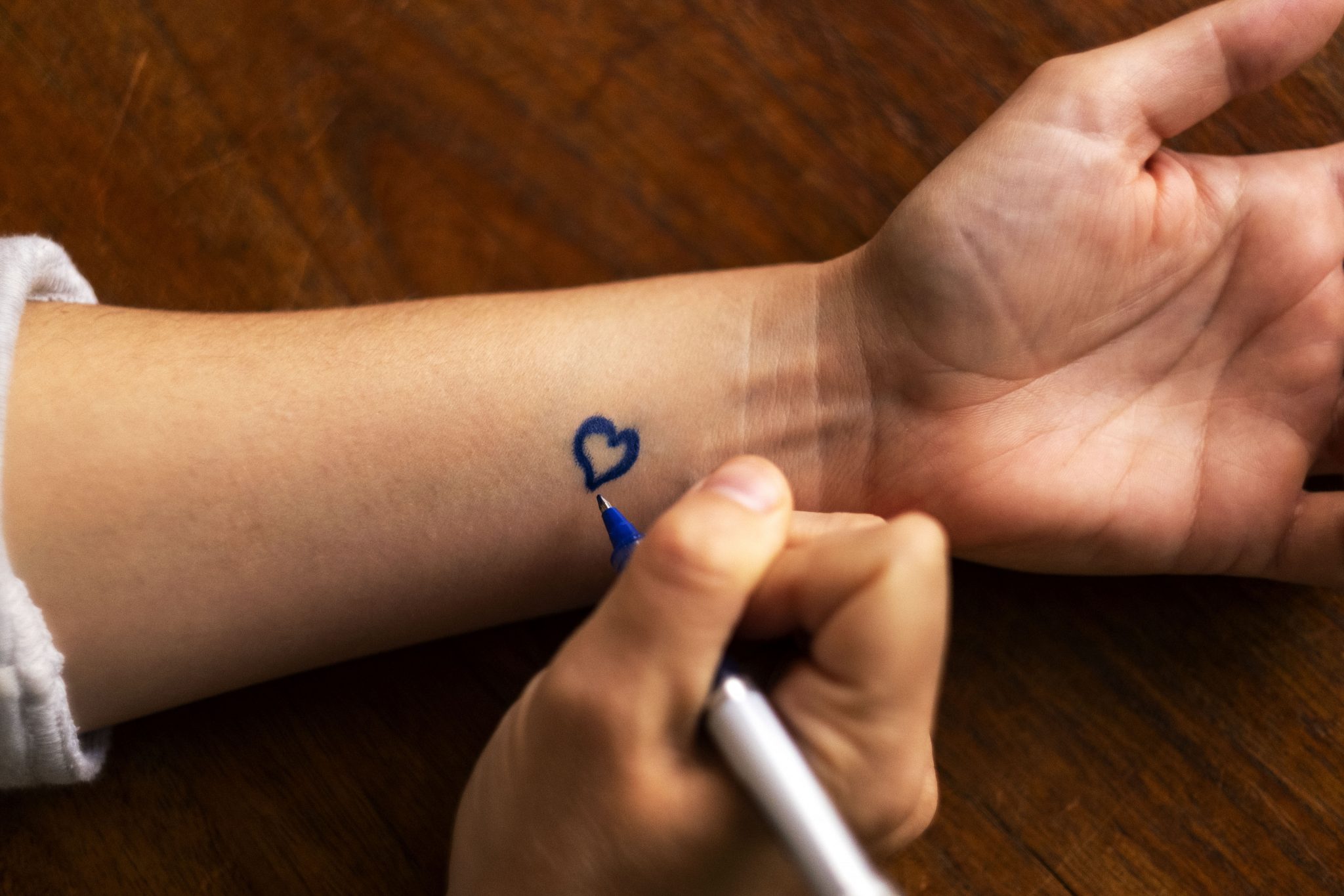 Prompts like a small heart drawn on your wrist can help you practice gratitude. (Photo by Jon Gardiner/UNC-Chapel Hill)