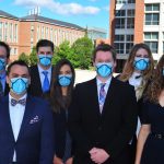 group of innovators shown wearing their new mask invention