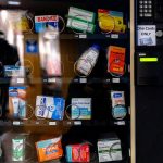 A vending machine containing health-related items such as cough drops and band-aids sits inside one of the doorways of the Student Union on January 25, 2021, on the campus of the University of North Carolina at Chapel Hill. (Johnny Andrews/UNC-Chapel Hill)