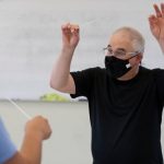 Professor Even Feldman shown conducting with a mask on