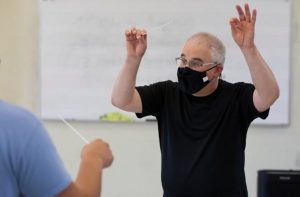 Professor Even Feldman shown conducting with a mask on