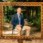Carolina clinical psychology professor Jonathan Abramowitz poses for a portrait under the arbor in Coker Arboretum. (Johnny Andrews/UNC-Chapel Hill)
