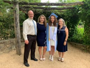 The Youngstrom family smiling at a Carolina graduation