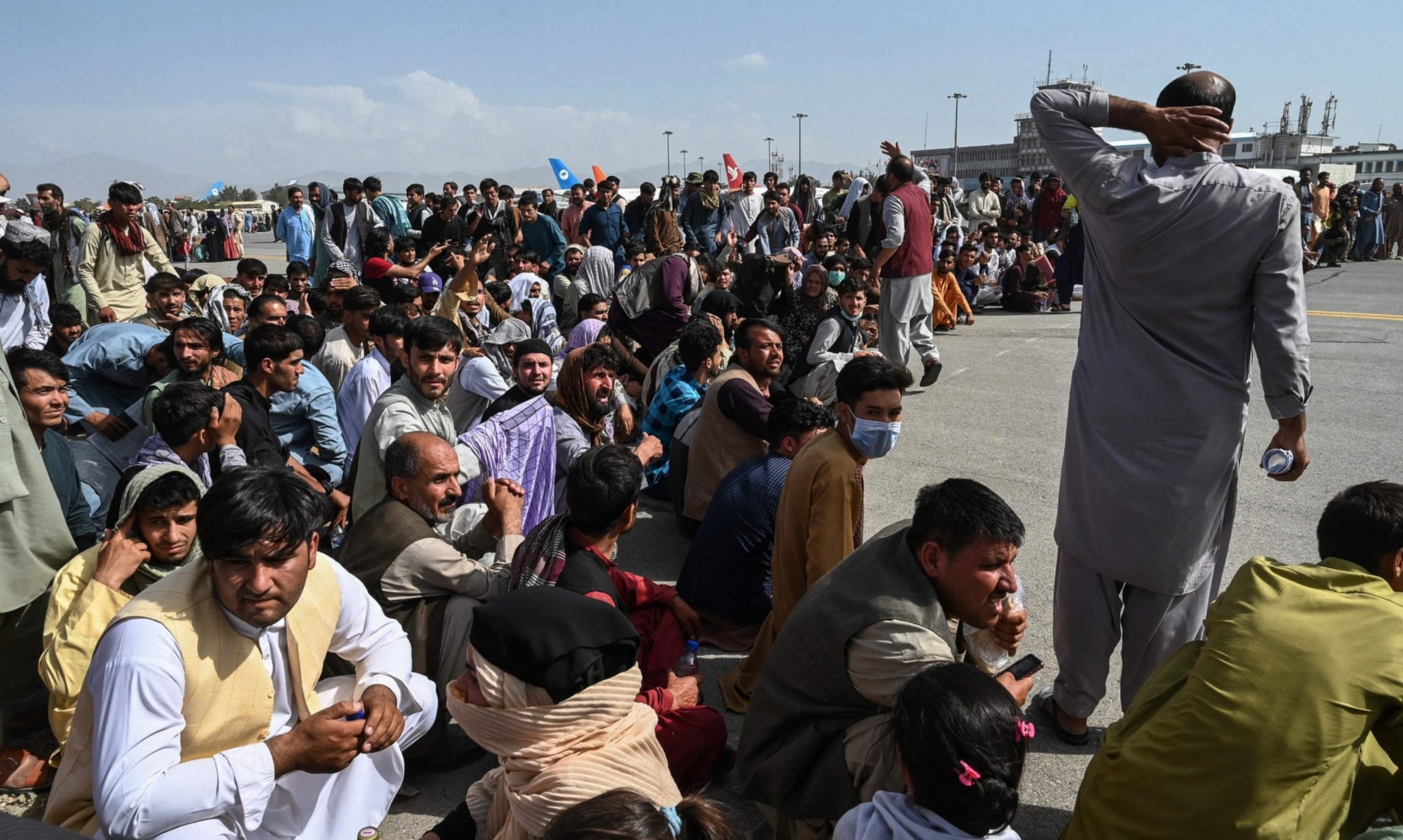 After the U.S. withdrawal of troops and the Western-backed government’s fall to the Taliban, Afghan citizens fled to the Hamid Karzai International Airport in the hope of catching a flight out of the country. (John Smith 2021 / Shutterstock.com) 