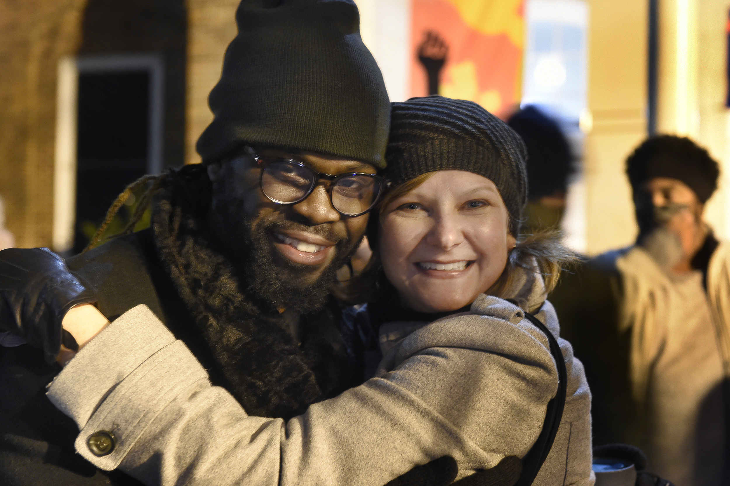 C.J. Suitt and Heather Tatreau share a hug and smiles at the Peace and Justice Plaza.