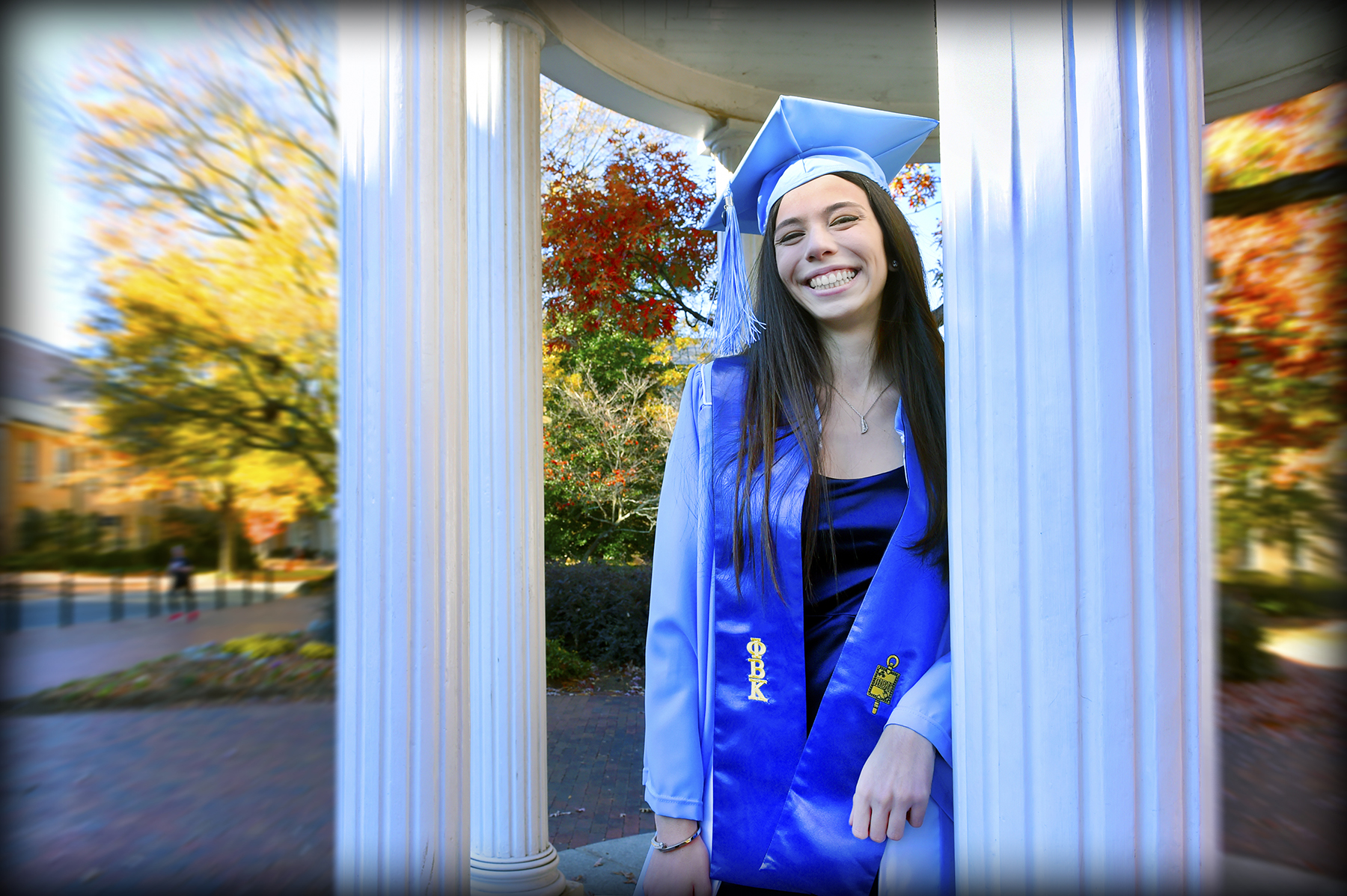 Maria Emilia Mazzolenis at the Old Well in her cap and gown.
