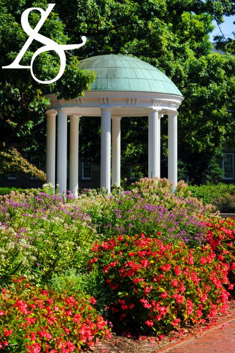 Mobile background of spring flowers in front of the Old Well with the College of Arts & Sciences ampersand