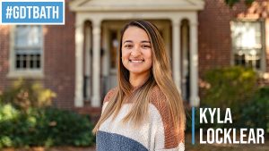 A headshot of Kayla Locklear with the text "#GDTBATH" in the top corner