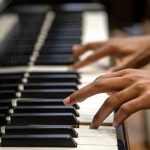 A student playing the piano