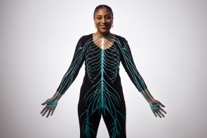 A student with the nervous system outlined on her body