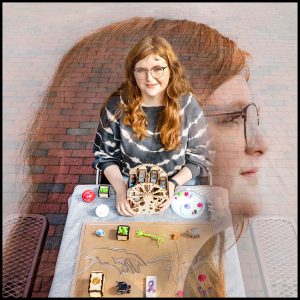 A photo of Sarah Ferguson sitting at a table with her art on campus and a close up shot of her profile blurred over the background image