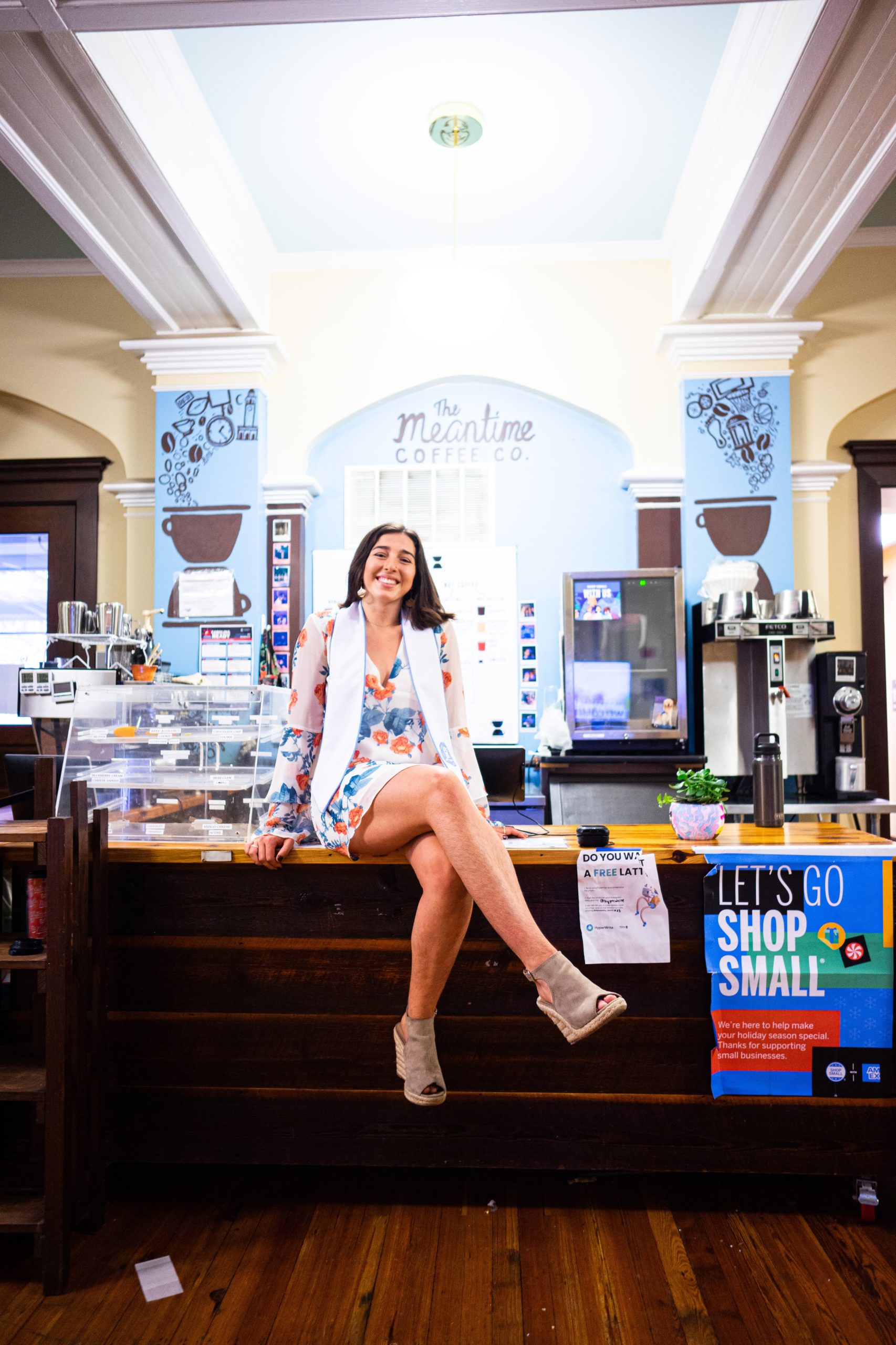 Alaina Plauche sits on a counter at the Meantime Coffee Shop in the Campus Y.
