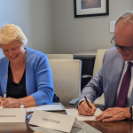 UNC's Barbara Stephenson (left) and USFQ's Diego Quiroga (right) sign agreement to renew strategic partnership.