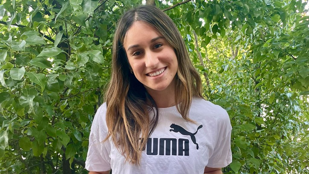A headshot of Jordan Feldman who wears a Puma t-shirt