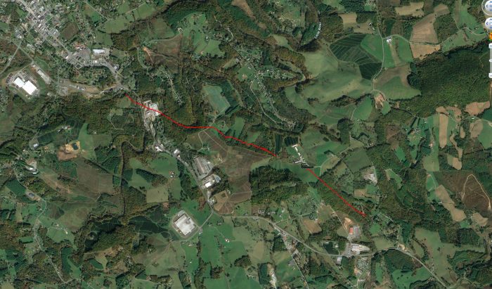 An aerial map shows the fault line in red.