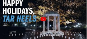 Still image from video shows the Old Well witht the words "Happy Holidays Tar Heels" written on the image.
