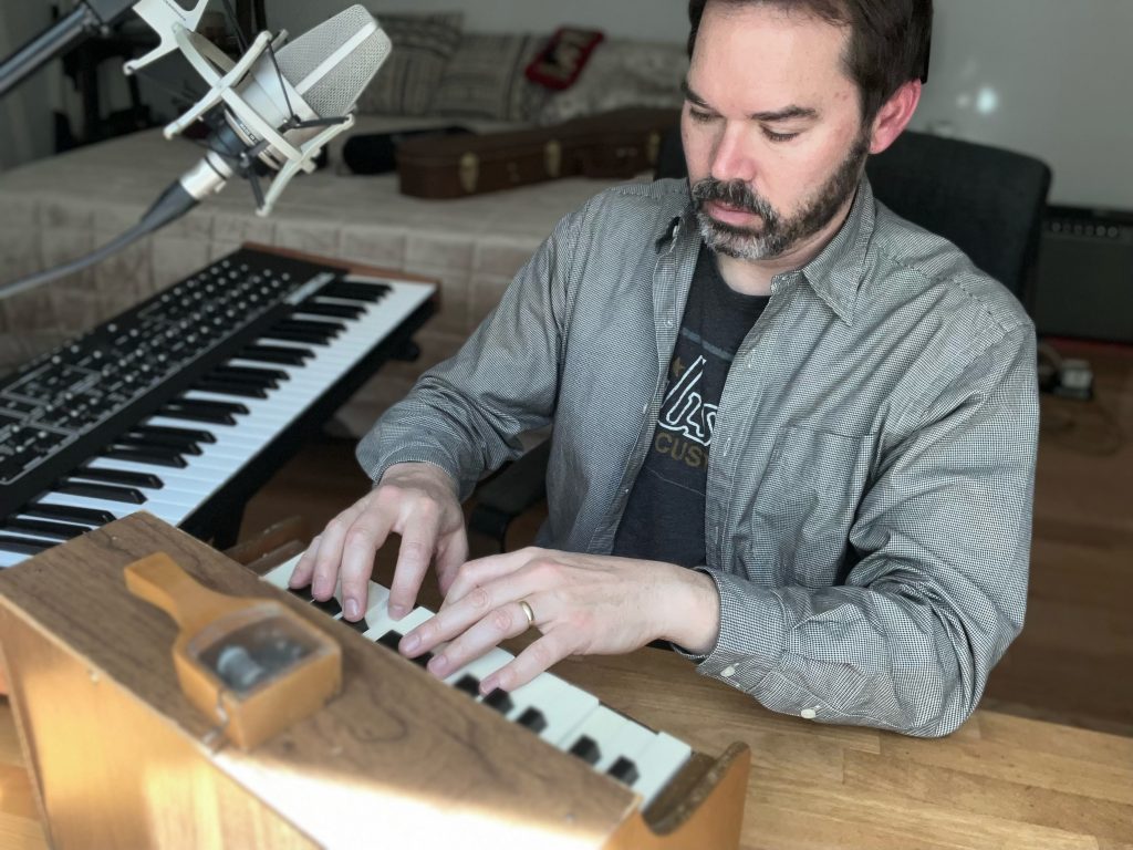 Lee Weisert plays a toy piano.