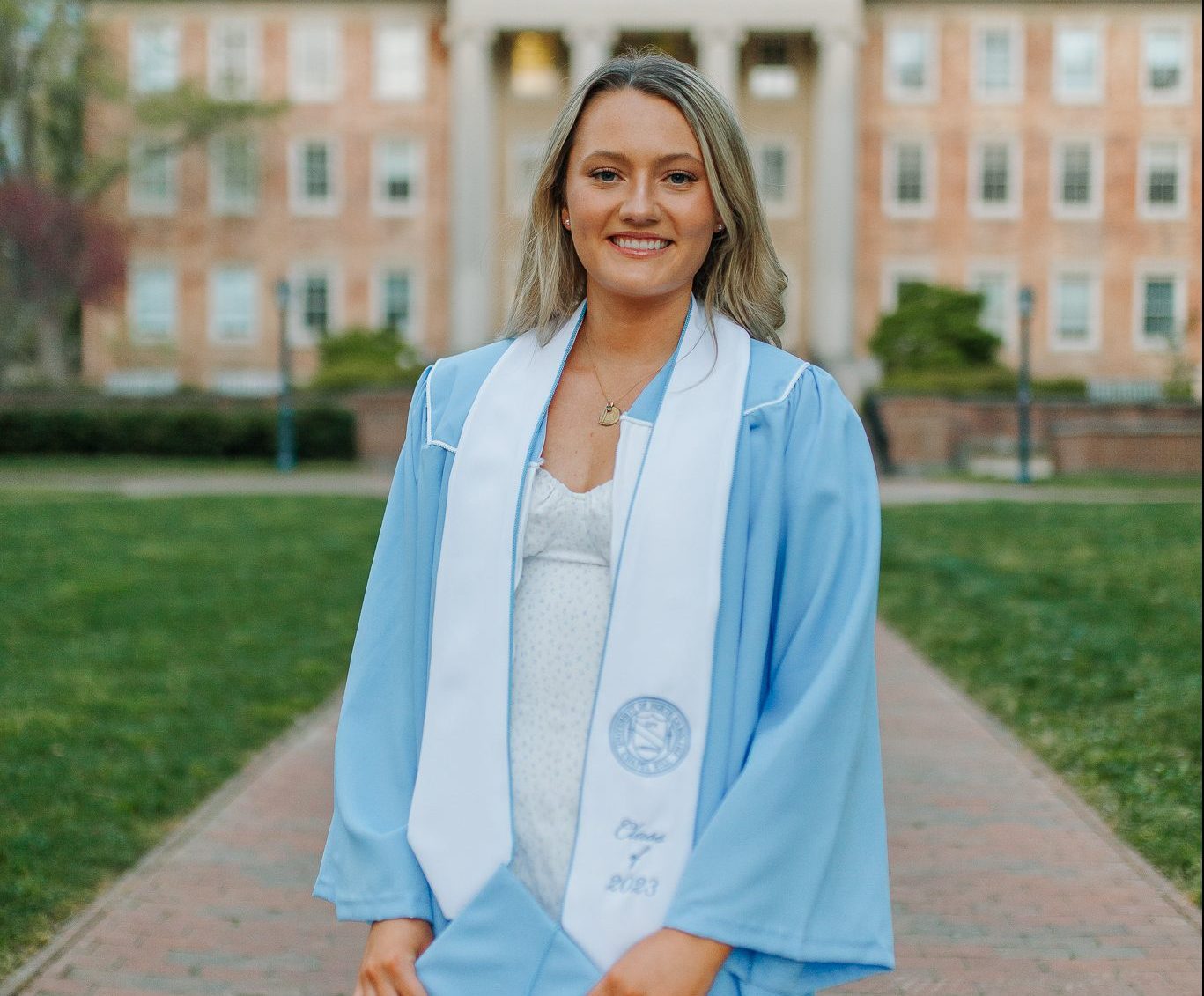 Erin Storch stands in front of South Building on UNC's campus.