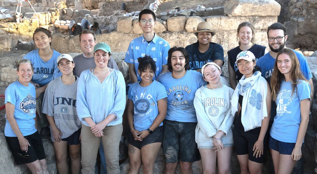 A group photo of Jodi Magness and current and former UNC students at the Huqoq site.