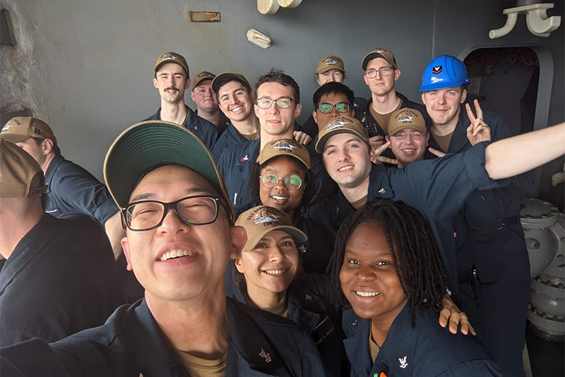 A group selfie with Kaela Hunter and other Navy sailors.