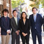 (left to right) Kiernan Almand, Aidan Maguire, Ethan Severson, Callie Kim, Jack Preble and John Cole McGee in suits.