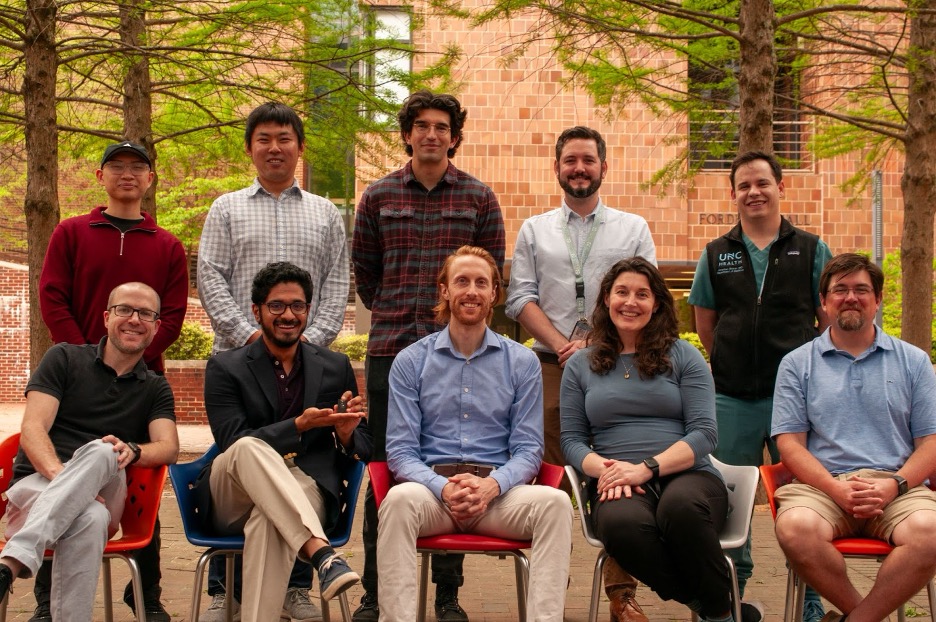 A group photo of the researchers, who are facing the camera in this outside photo.