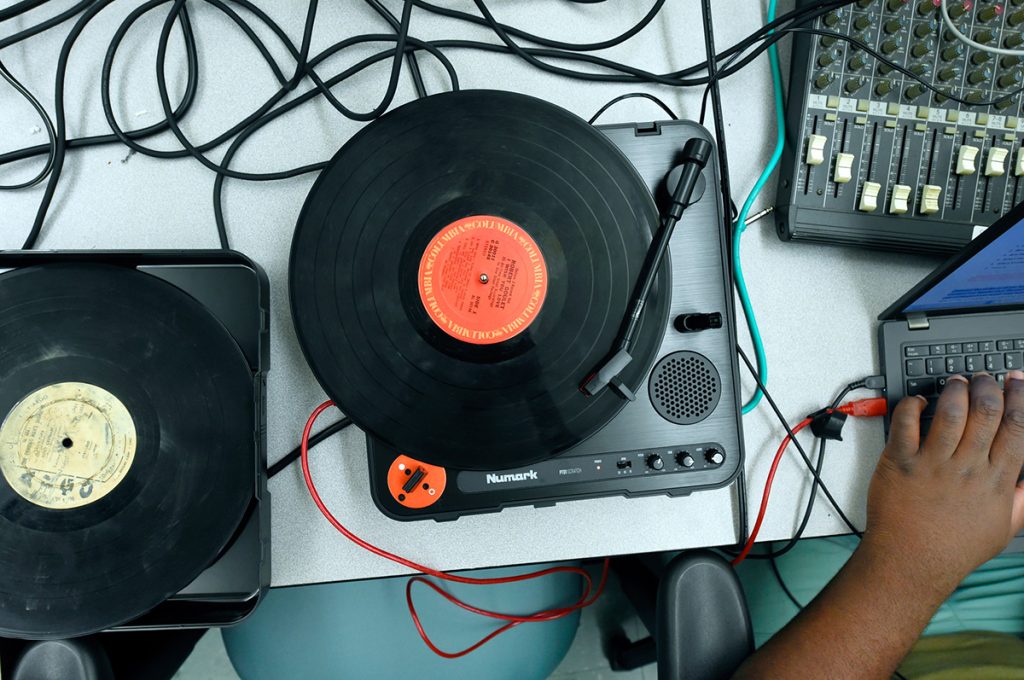 A closeup of a vinyl record on a record player in the Beat Lab at the Carolina Hip Hop Institute summer 2024.